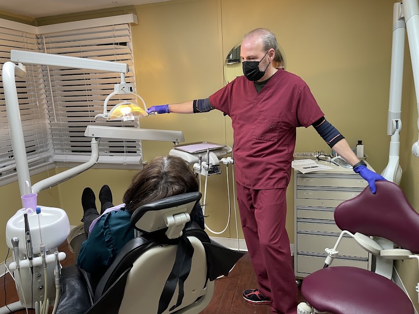 A Design That Smile staff member working in a treatment room